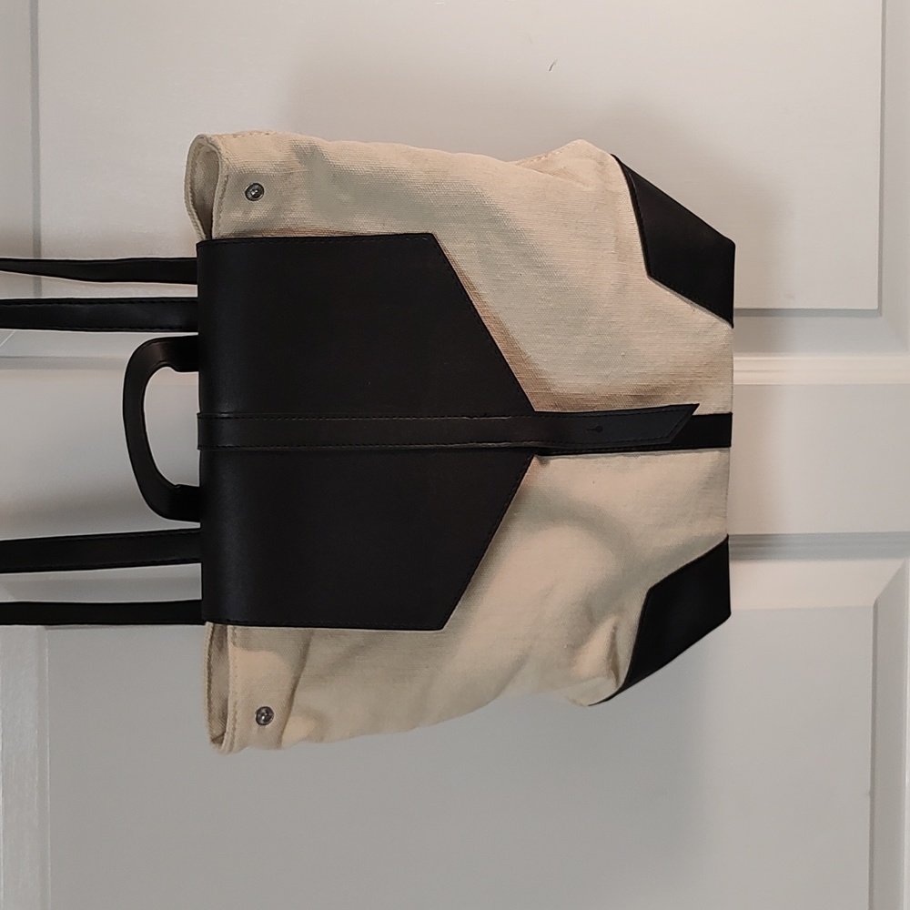 Beige black backpack type bag